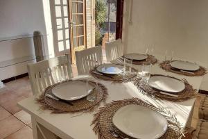 a table with plates and napkins on top of it at MAZET DE LORGUES in Lorgues +9 photos