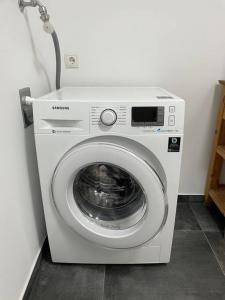 a washing machine is sitting in a room at Im Herzen von Barsinghausen in Barsinghausen