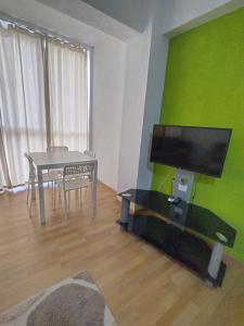 A television and/or entertainment centre at Vila Nova