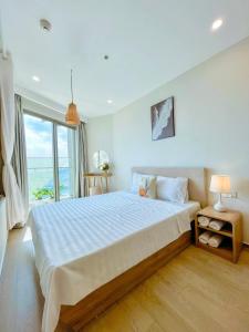 En eller flere senge i et værelse på The sóng Remy Apartment