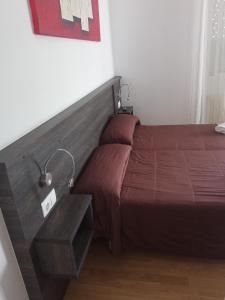 Ein Bett oder Betten in einem Zimmer der Unterkunft Pensión KM66 Palas de Rei