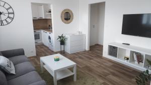 a living room with a couch and a table at Byteček na Polní in Hodonín