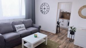 a living room with a couch and a table at Byteček na Polní in Hodonín