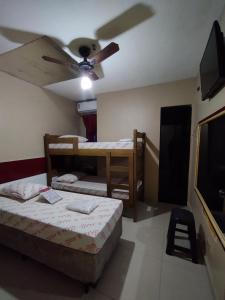 Postel nebo postele na pokoji v ubytování Hotel cowboy Interlagos próximo do autódromo