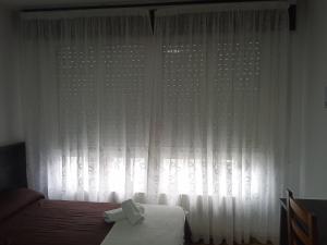 Ein Bett oder Betten in einem Zimmer der Unterkunft Pensión KM66 Palas de Rei