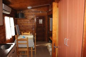 a dining room with a table and chairs in a cabin at Citrigni in Peschici