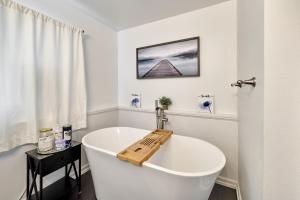 a white bath tub in a white bathroom at Home - Elegant comfort 22 minutes to OSU in Lebanon +20 photos