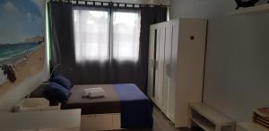 Łóżko lub łóżka w pokoju w obiekcie Apartamento muy cercano a playas y pueblo Puerto del Carmen