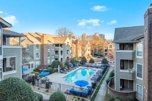 an aerial view of a pool in a apartment complex at Charming Apartment with Wi-Fi in Charlotte