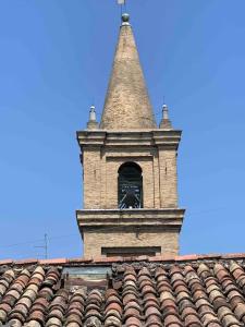 a clock tower on top of a building at Olivietta Suite in Cervia