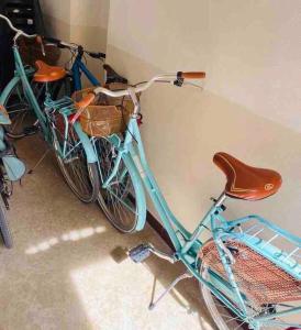 two bikes are parked next to a wall at Olivietta Suite in Cervia