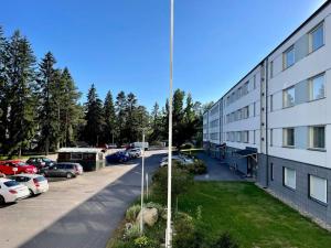 arial view of a parking lot next to a building at 3 h + keittiö ja parveke, juuri remontoitu! in Lahti