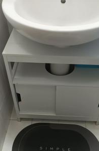 a white bathroom sink sitting on top of a shelf at Casa Reale in Gravina di Catania +43 photos