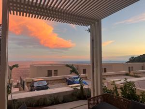 a view from the patio of a house at 3M Villa, Green Coast Resort, Optional-Personal Buggy available in Palasë
