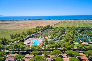 an aerial view of a resort with a pool and the ocean at Villaggio Orizzonte in Riotorto
