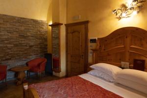 Postel nebo postele na pokoji v ubytování Hotel Le Ortensie