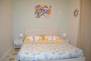 a bedroom with a bed with two towels on it at Best Residence **** in Termoli