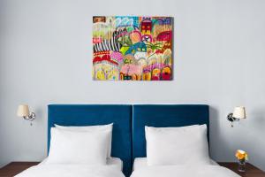 Postel nebo postele na pokoji v ubytování Alma Boutique Hotel