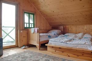 Postel nebo postele na pokoji v ubytování Etno Begovo Selo
