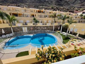 an image of a swimming pool in front of a building at Los Mangueros Beach 6 in Puerto de Mogán