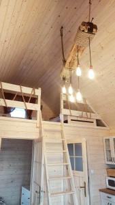 a room with two bunk beds in a house at Domek Nad Stawem in Gołdap