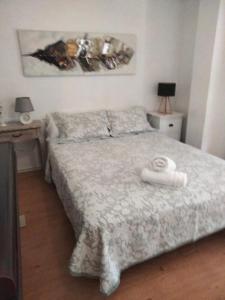 A bed or beds in a room at EL RINCON DE LUZ