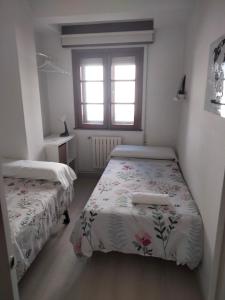 A bed or beds in a room at EL RINCON DE LUZ