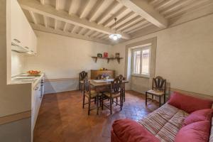a living room with a couch and a table at I Bei Ricordi - Historic Centre Apartment 6 in Arezzo +19 photos