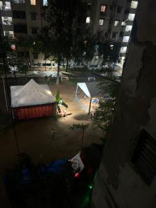 a tent in the middle of a city at night at Aayushman Homes in Bangalore