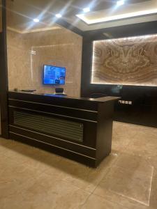 فندق دان البلاتيني tesisinde bir televizyon ve/veya eğlence merkezi