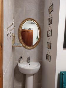 a bathroom with a sink and a mirror at Portobello Charming Seaside 3-BR Holiday Apartment in Edinburgh