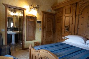 Postel nebo postele na pokoji v ubytování Hotel Le Ortensie