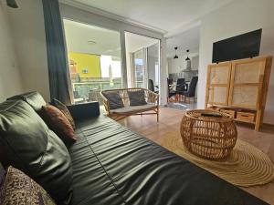a living room with a couch with a basket on the floor at Vila Regina Apartment Rex with Swimming Pool in Jezera