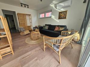 a living room with a couch and a table at Vila Regina Apartment Rex with Swimming Pool in Jezera