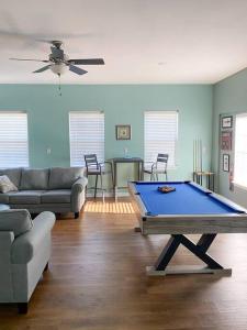 a living room with a pool table in it at Spacious Home near Gulf Shores & Orange Beach in Foley