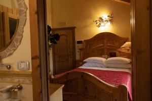 Postel nebo postele na pokoji v ubytování Hotel Le Ortensie