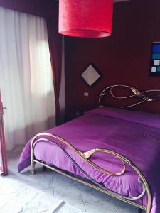 Een bed of bedden in een kamer bij Atene Apartment