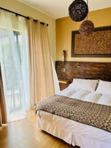 Postel nebo postele na pokoji v ubytování Blumen Hotel