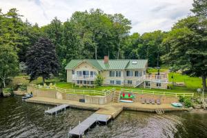an aerial view of a house on the water at Waterfront Sidney Getaway with Private Dock! in Belgrade