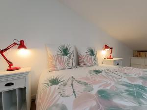 Voodi või voodid majutusasutuse Jolly Cottage - T2 60m2 Lumineux toas