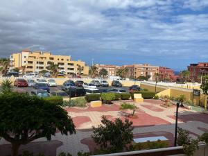 a parking lot with cars parked in a parking lot at Apartamento LOLO in El Médano