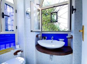 a bathroom with a sink and a window at Il Tremolar Della Marina in Casalbordino +84 photos