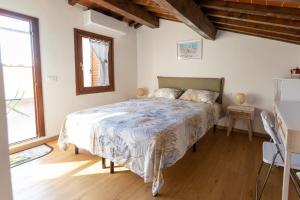 Postel nebo postele na pokoji v ubytování La Terrazza di Emy, Arezzo - affitto turistico