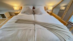 Letto o letti in una camera di TinyLoft