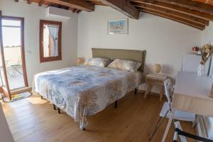 Postel nebo postele na pokoji v ubytování La Terrazza di Emy, Arezzo - affitto turistico