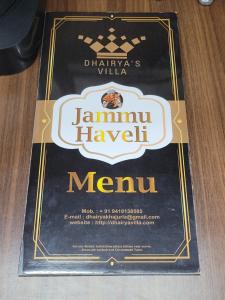 un menù per una taverna manuvian su un tavolo di Dhairya's Villa Home Away From Home a Jammu