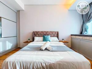 Pine Tree Suites by RR JBcity客房内的一张或多张床位
