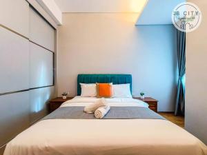 Pine Tree Suites by RR JBcity客房内的一张或多张床位
