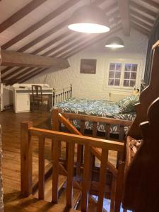 a room with a bed and a table in it at Chalet 09 in Albiès +28 photos
