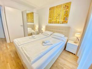 Posteľ alebo postele v izbe v ubytovaní Steiner Residences Vienna Nestroyplatz